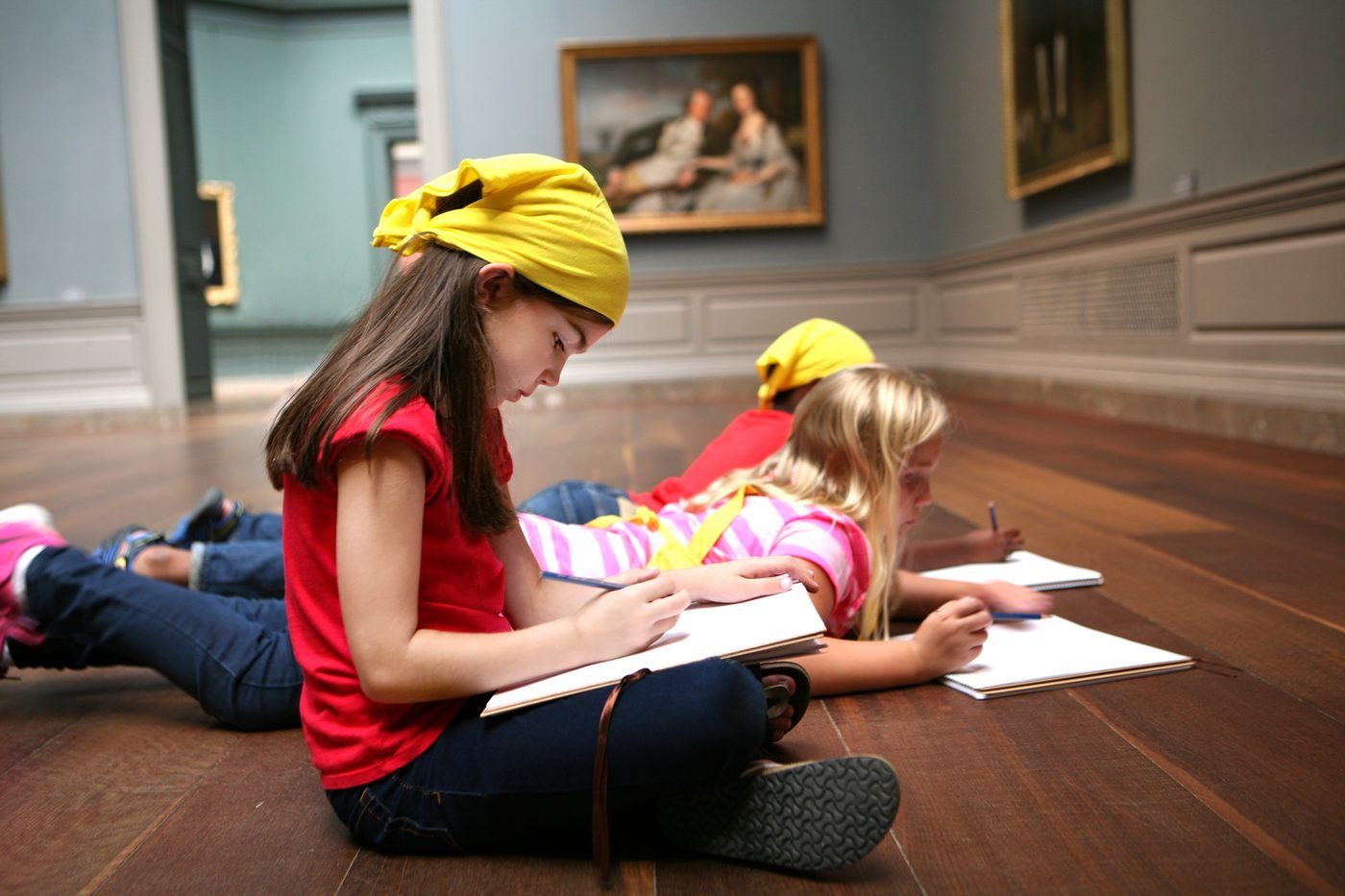 Children drawing in a gallery